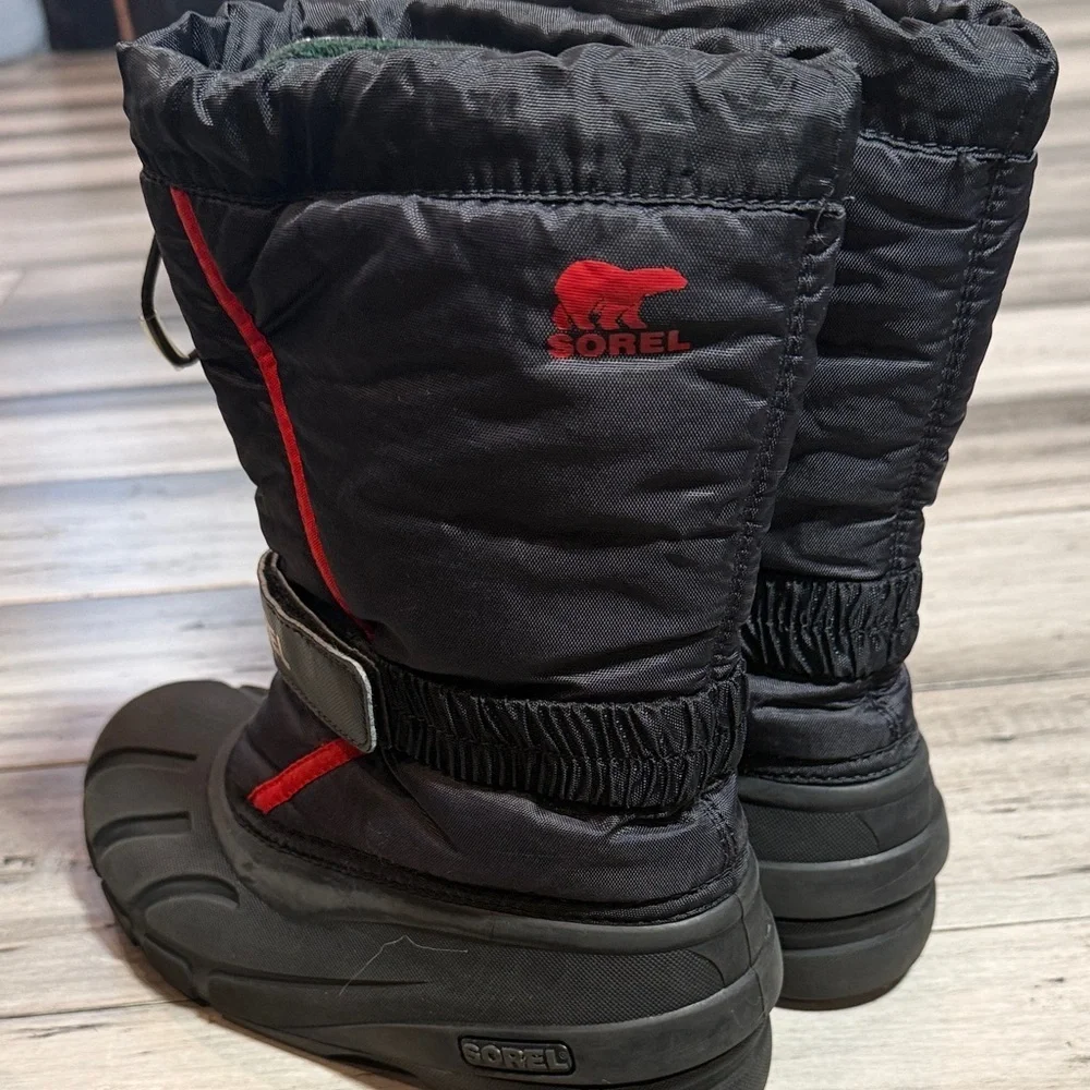 Sorel Men  Black Winter Boots with Red Accents
